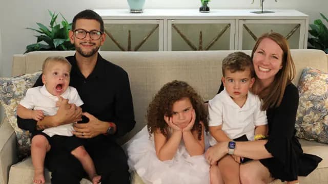 Jacob, Erin, and their kids in a field