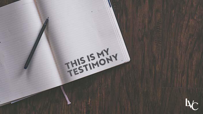 An open journal with the words "this is my testimony" written on it.